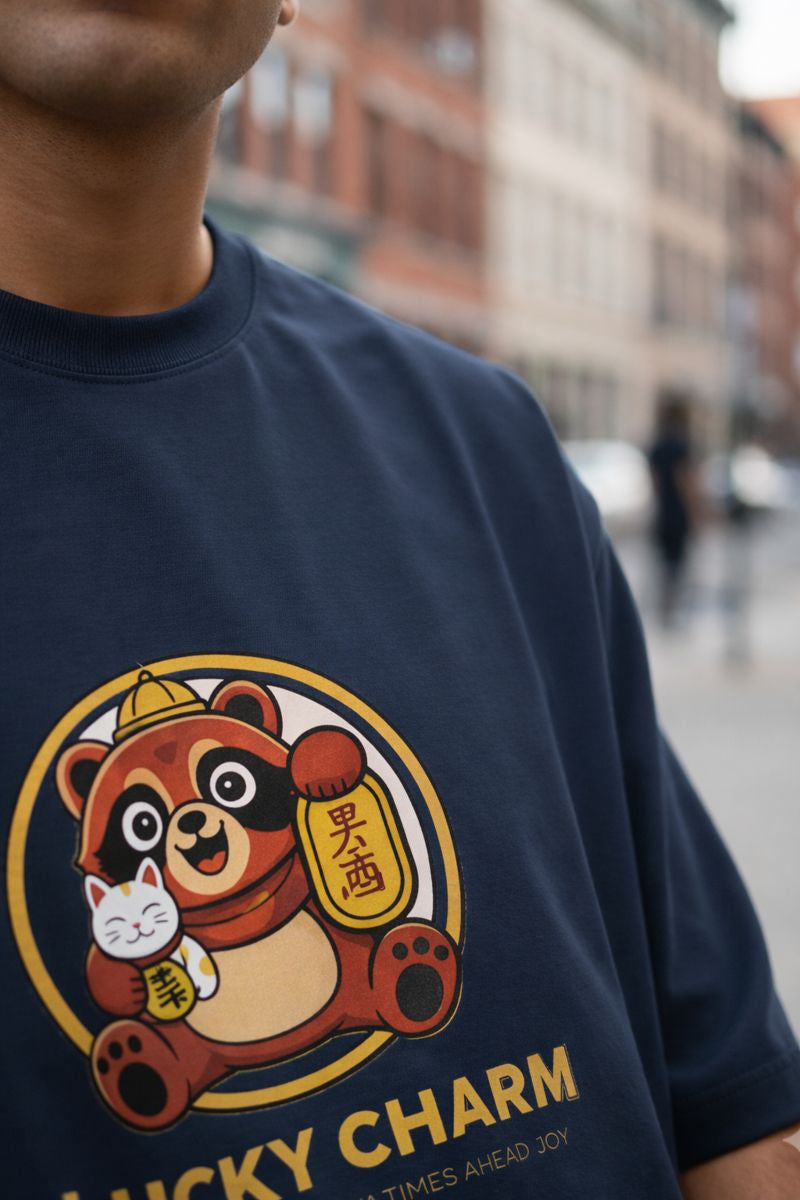 Close up of lucky charm panda front print on navy oversized t shirt