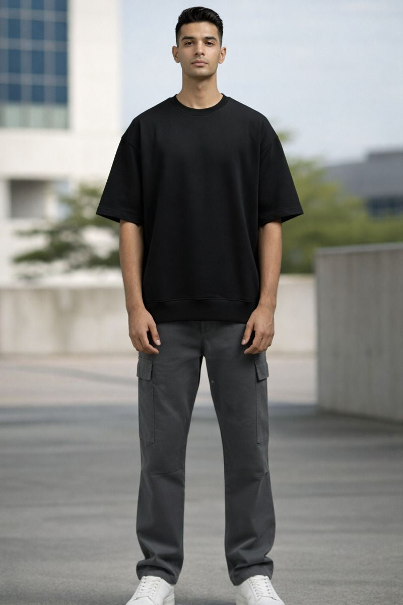 Black oversized t shirt for men front view minimal streetwear look